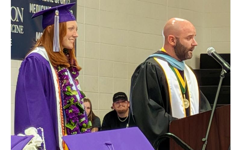 Submitted photo.  Mitchell High School principal Cole Chester, right, introduces Mitchell High’s 2025 class valedictorian Ivy Young, left.