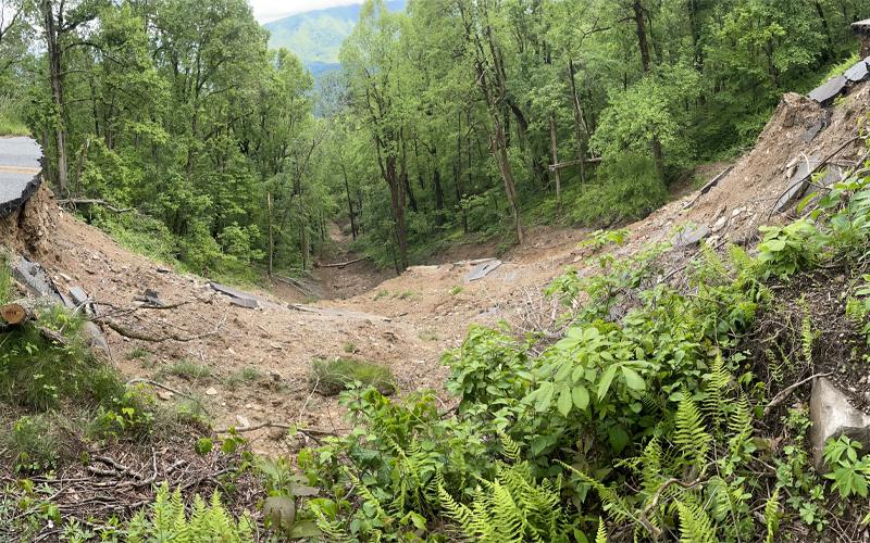 MNJ Photo/Mariel Williams.  This panoramic view of the Blue Ridge Parkway washout near Little Switzerland distorts the width of the hole slightly in order to get the full scope of the damage in view.