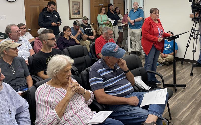 MNJ Photo/Mariel Williams. Gloria Thomas of Poplar speaks to the Mitchell Board of Commissioners about her experiences living across from the controversial new Horizon 30 mine. The commissioners’ meeting last week was packed with citizens concerned about the mine.