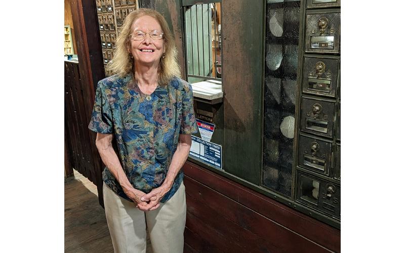 MNJ Photo/Steffen Silvis.  After being closed for some time for storm repairs, the Penland Post Office is back in action, and Postmaster Rebecca Davis has returned to her home away from home.