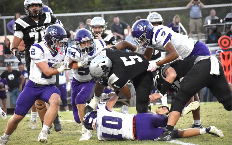 Photo/Bella Eddings/Graham Star. Kaden Buchanan (#10) take a hit from a Robbinsville player.