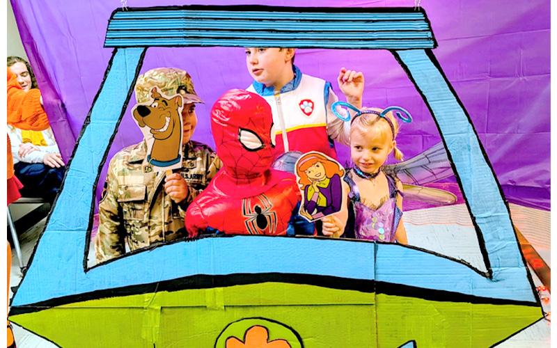 MNJ Photo/Steffen Silvis .  From left to right, Jonah Crowder, Liam Knowles, Jude Williams and Rowan Knowles enjoy an imaginary ride in the “Scooby-Doo” Mystery Machine.