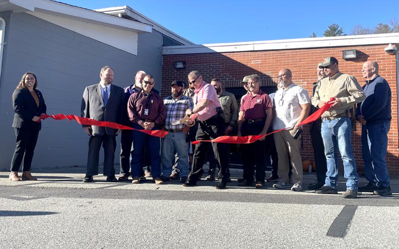 MNJ Photo/Mariel Williams.  Sheriff Donald Street cuts the ribbon on the new Mitchell County Law Enforcement Center.