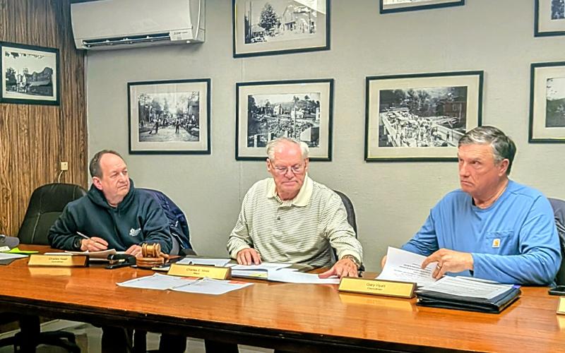 MNJ Photo/Steffen Silvis.  From left, Councilman Charles Nash, Mayor Charles Vines and Councilman Gary Hyatt listen to a presentation on plans to reinvigorate Bakersville.
