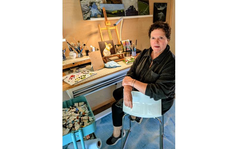 MNJ Photo/Steffen Silvis.  Dana Moore works on both a dog and a cat portrait in her Deer Park Lake Studio.
