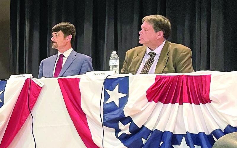 MNJ Photo/Mariel Williams.  Moderator Bob Hensley explains the rules of the Mitchell County Chamber of Commerce candidate forum to judicial candidates S. Justin Ray, left, and Eric Eller.
