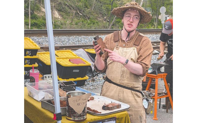 MNJ Photo/Steffen Silvis. Atlanta-based metal artist, Jay Reddish, explains his sand-casting technique.