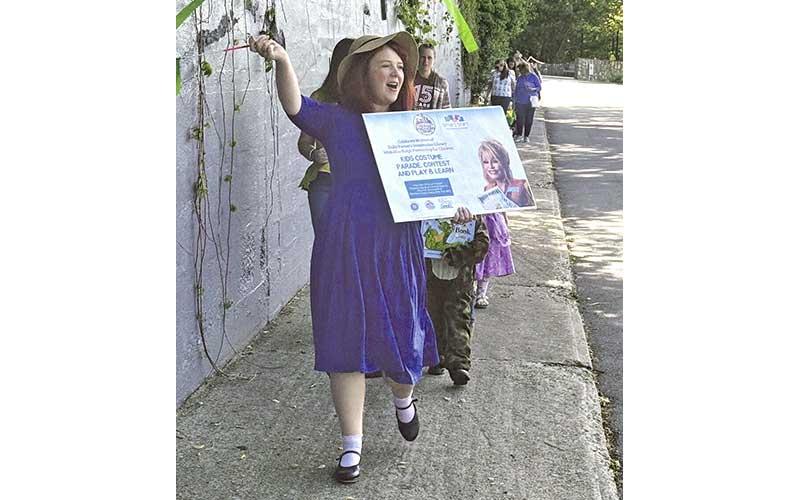 MNJ Photo/Laz Aguayo - Local children dressed up in costume and headed down Lower Street (Locust Avenue) to celebrate 20 years of Dolly Parton’s Imagination Library recently.
