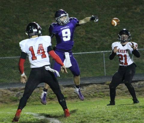 Mitchell junior Ty Sparks attempts to deflect a Troy Hoilman pass Friday, Nov. 8, during the Mountaineers' 51-6 win over the Vikings. (Brandon Roberts/MNJ)