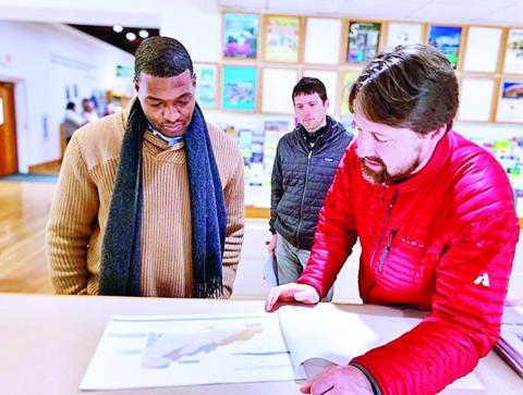 North Carolina Department of Environmental Quality Secretary Michael Regan listens to staff from the North Carolina Geological Survey talk about landslide mapping capabilities Thursday, Nov. 14, at the Museum of North Carolina Minerals in Spruce Pine. (Submitted)