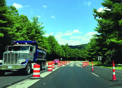 Traffic on U.S. 19E heading toward the Estatoe area merges into a single lane as cones block off some areas of the road. The project to widen the road from this point to Burnsville should be complete by the middle of September, an NCDOT official confirmed. (MNJ photo/Cory Spiers)