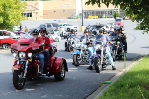 The first wave of vehicles that were part of the Maggie’s Ride convoy leaves the parking lot of the Spruce Pine Walmart Saturday, Aug. 22. Each vehicle in the convoy paid $20 to ride and all proceeds went to the Maggie Young Memorial Scholarship fund. The event raised nearly $2,000. (MNJ photo/Cory Spiers)