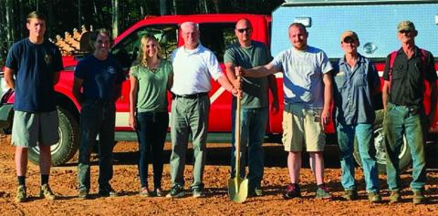 Volunteers pose for a photo. before beginning work on a new substation for the rural Rhododendron Fire District. Bakersville Fire and Rescue started construction on the substation earlier this month. The substation will allow the department to provide continued protection to the Bandana community. (Photo submitted)
