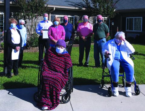 Mitchell House residents Ruth Archer (102) and Mabel Elberta Wing (99) (front) were honored by the High Country Area Agency on Aging during a special ceremony on Monday, Sept. 21. In the back, from the left, celebrating with the duo is Norma Duncan, Charles Duncan, Tim Greene, Darla Harding, Richard Canipe, Charles Vines and Jeff Harding. (Submitted photo) 