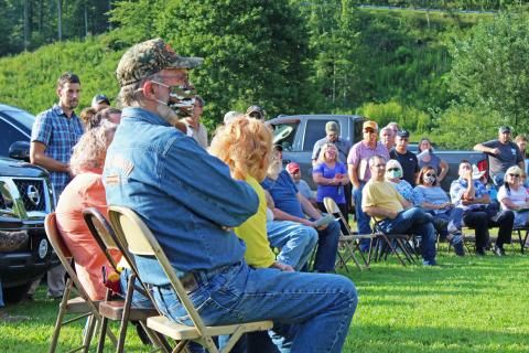 A group sits and listens Tuesday, Aug. 25 during the special meeting of the Mitchell County Commissioners at the Poplar Community Building. (MNJ Photo/Juliana Walker)