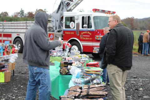 A vendor speaks with a possible customer at Remember When Day on Oct. 31. The festival featured vendors, food, live music and antique tractors, cars and trucks. (MNJ Photo/Juliana Walker)