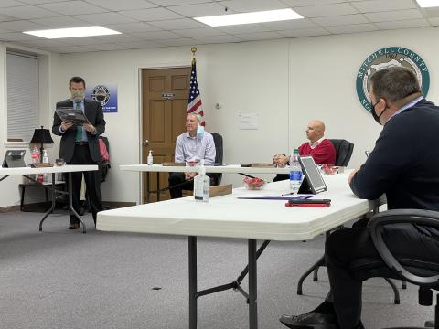 Commissioner Matthew “Vern” Grindstaff (left) reads off the text inscribed on plaques that were presented to Jacob Willis and Danny Burleson, who will both leave the board. Willis and Burleson each gave short addresses regarding their time on the board. (MNJ photo/Juliana Walker)