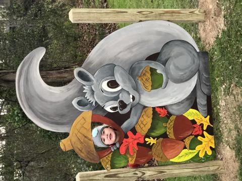 Piney the Squirrel, the mascot for the new Riverside Park story trail tale, greets visitors with a smile and a prime photo opportunity. Piney was created by Penland School of Craft artist Day Dotson. The story trail is a parnership between AMY Regional Library, Blue Ridge Partnership for Children, Penland School of Craft, Williams YMCA of Avery County and the Town of Spruce Pine. (Submitted photo)