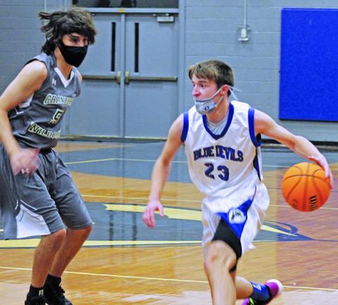 Ian Ledford (23) looks for space as he prepares to drive the paint during a home game against Cranberry earlier this month. Ledford scored a team-high 15 points in the team’s win over Cranberry. The Harris boys also put together double-digit wins over Avery, East Yancey and Bowman earlier this month. (Photo courtesy of Harris Middle School/Stephanie Warren)