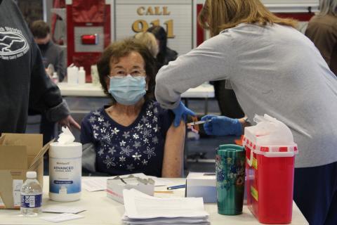 Patsy Covington, 83, excitedly receives her vaccine in the garage area of the fire department on Thursday, Jan. 14. “I’m tired of all of this uncertainty of whether or not I’m going to get this virus,” Covington said. (MNJ Photo/Juliana Walker)