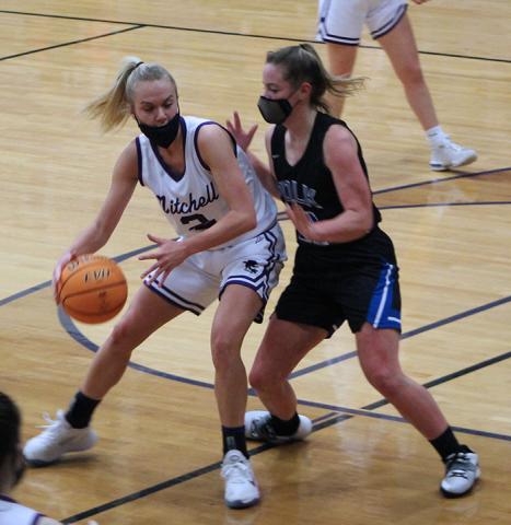 Mitchell senior Paige Johnson backs down a Polk defender on Friday, Feb. 12 during a home game in Ledger. Johnson scored 11 points and helped the Mountaineers win the game 62-41 to move to 12-0 on the season. (MNJ photo/Cory Spiers)