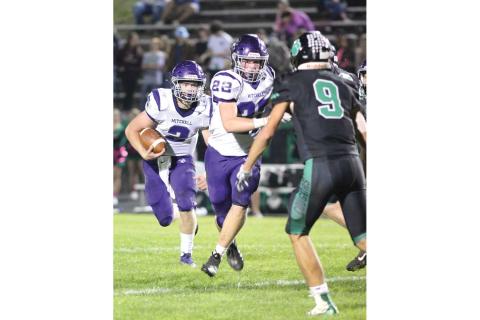 The only obstacle between Mitchell wide receiver Gabe Brandt (2) and a Cougar lineman is teammate Carter Holye (22).  (MNJ photos) 
