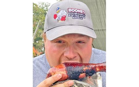 MNJ Photo/Rachel Hoskins - Hudson Boone of the Spruce Pine Fire Department said hands down the Mitchell County Fireman’s Association had the best barbecue. 