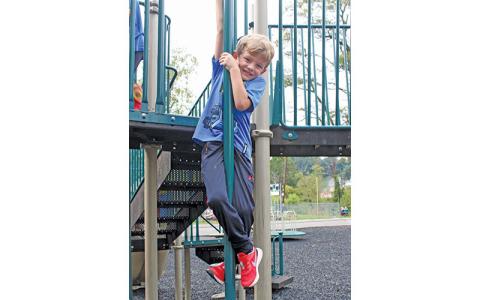 MNJ Photo/Rachel Hoskins - Five-year-old Eason Hutcheson is one of thousands of children that benefit from Rotary projects in Mitchell County. According to his meme, Melora Bennett, the Kids Park is his favorite place to be on a sunny day.