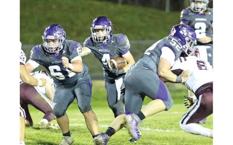 Sophomore Chase Duncan (4) looks for running room as juniors Chandler Horney (61) and Nate Stamey (52) attempt to open up a hole during a playoff win over visiting Swain. (MNJ photo/Cory Spiers)