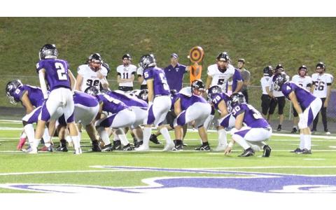 MNJ photo/Macie Greene - Mountaineer quarterback Caleb Cook (5) waits for the snap during Friday night’s game against Avery.