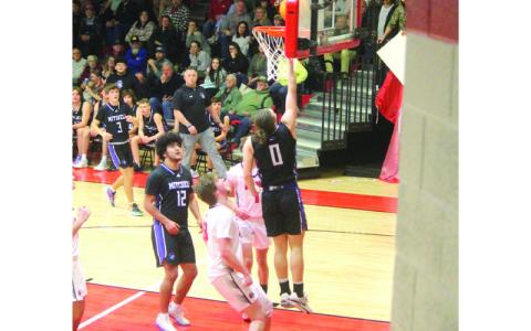 Photo/Stephanie Warren. #0 Dillon Barnett elevates for the layup. 