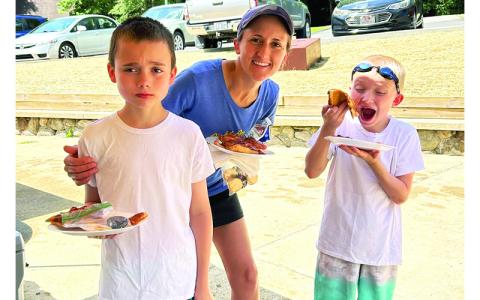 MNJ photos/Sarah Quintas. Kayla, Wesson, and Walker Blevins enjoy free pizza at the Brad Ragan Park reopening. 