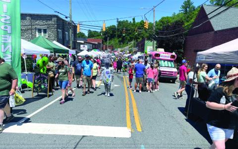 MNJ photos/Mariel Williams. Aliens of all shapes and sizes came to Spruce Pine Saturday to shop, play, listen to music and participate in the Alien Festival costume contest, among other activities.