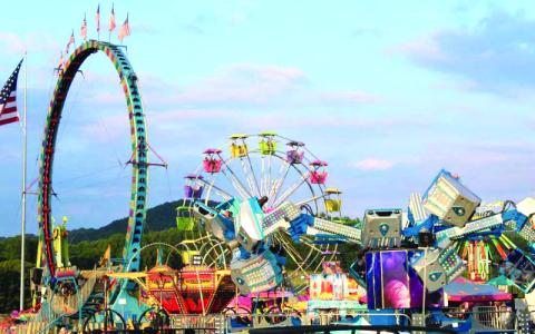 MNJ Photos/Sarah Atkins. The B&K Carnival has fun rides for all ages, including a new one called the Orbiter. Carnival goers enjoy riding the Ferris wheel and swings.