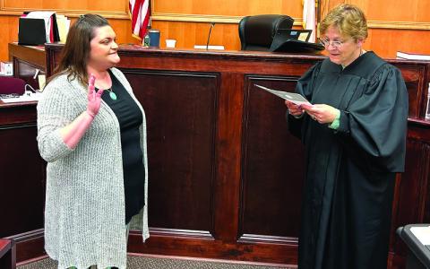 Photo submitted. District Court Judge Rebecca Eggers-Gryder, right, swears in Mitchell County’s newest Guardian ad Litem, Megan Hicks, in the Mitchell County Courtroom.