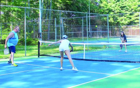 MNJ photo/Sarah Atkins. From left, Delee Scott, Christine Ramsey, Maya Ramsey and Edward Ramsey play pickleball at the new courts at Brad Ragan Park.