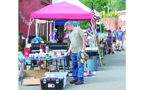 Shoppers and vendors line the streets of downtown Bakersville for annual community yard sale.