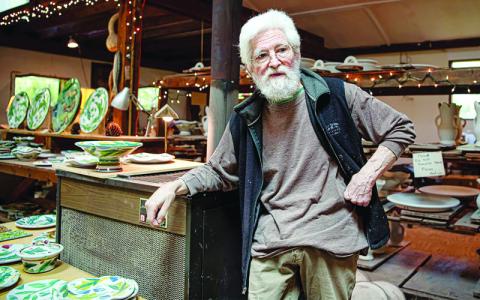 Submitted photo.  Stanley Mace Andersen takes a break in his Mitchell County studio.