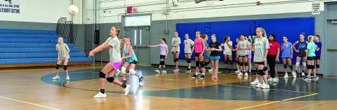 MNJ photos/Brian Hobson. Mitchell Middle School recently held volleyball tryouts. Here, a group of three girls attempt to pass the ball twice before putting it back over the net.