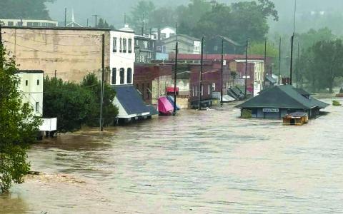 Submitted photo. Downtown Spruce Pine was flooded as Tropical Storm Helene rolled through Mitchell County on Sept. 26. The county continues to struggle without power, phone services or internet. 