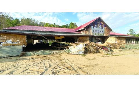 CNI photos/Randy Foster/editor@cherokeescout.com.  The Tin Crown consignment store off U.S. 19 East/N.C. 80 near Micaville was destroyed by flooding along Little Crabtree Creek. 