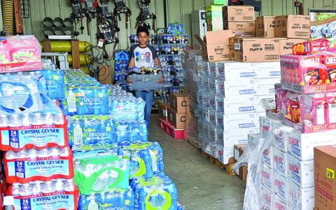 MNJ Photo/ Megan Horn.  As donations roll in to Mitchell County it takes an army of volunteers  and community members to sort and distribute them. 