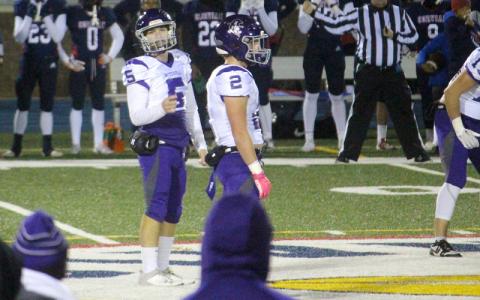 Special to MNJ/Stephanie Warren.  Caleb Cook waits for the play call from the sideline. Cook and the Mountaineers lost their playoff game to Corvian Community High School 42-6.