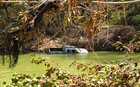 MNJ photo/Sarah Atkins.  Rising waters moved cars, and even homes, down the rushing North Toe River during Hurricane Helene.