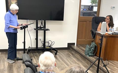 MNJ Photo/Mariel Williams.  Long-time Spruce Pine resident Susan Larson speaks to the Mitchell County Board of Commissioners. Larson was one of several citizens to bring concerns about a new regional library agreement to both the county board and the Spruce Pine Town Council recently.