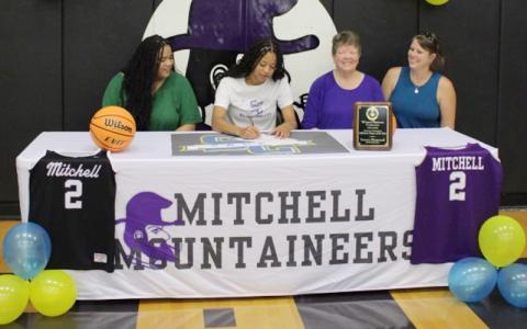 Submitted photo.  Lauren Ringwood commits to Salem College to play four years of basketball. From left are Lauren’s twin, Kathryn, Lauren, Sarah Hobart and aunt Whitney Hobart.