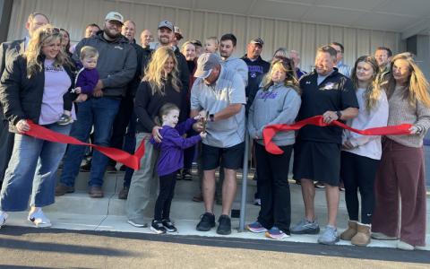 MNJ Photos/Mariel Williams. Mitchell County Recreation Department Director Brock Duncan cuts the ribbon on the new Recreation Center in Bakersville.