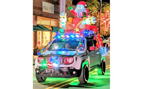 MNJ Photo/Steffen Silvis. Lines of festive cars join the Bakersville Christmas Parade.