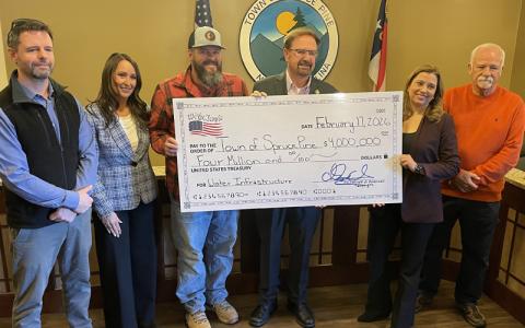  MNJ Photo/Mariel Williams.  U.S. Rep. Chuck Edwards recently visited Spruce Pine to present a check for new water infrastructure. From left are Town Manager Daniel Stines, Town Council member Tessa Taylor, council member Wayne Peight, Edwards, Mayor Beth Holmes and council member Rocky Buchanan.
