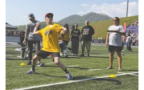 MNJ Photo/Jaren Gragg. Evan Bloemendaal throws a ball at the Special Olympics.